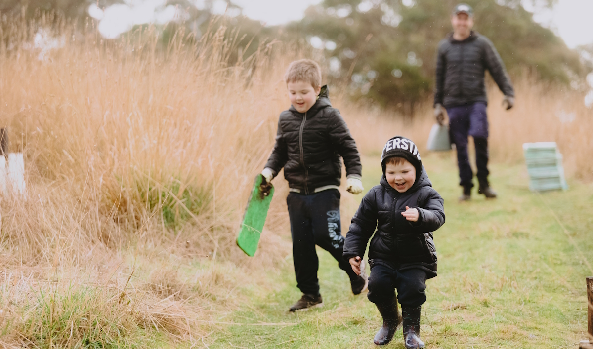 Kids happy planting trees